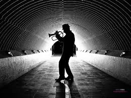 An image of a saxophone player using backlighting.